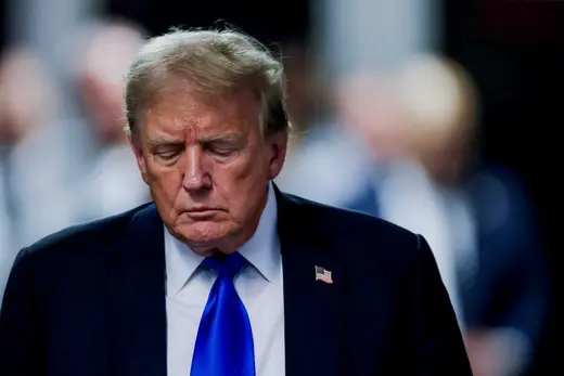 Trump as viewed leaving the courthouse in a blue tie. 